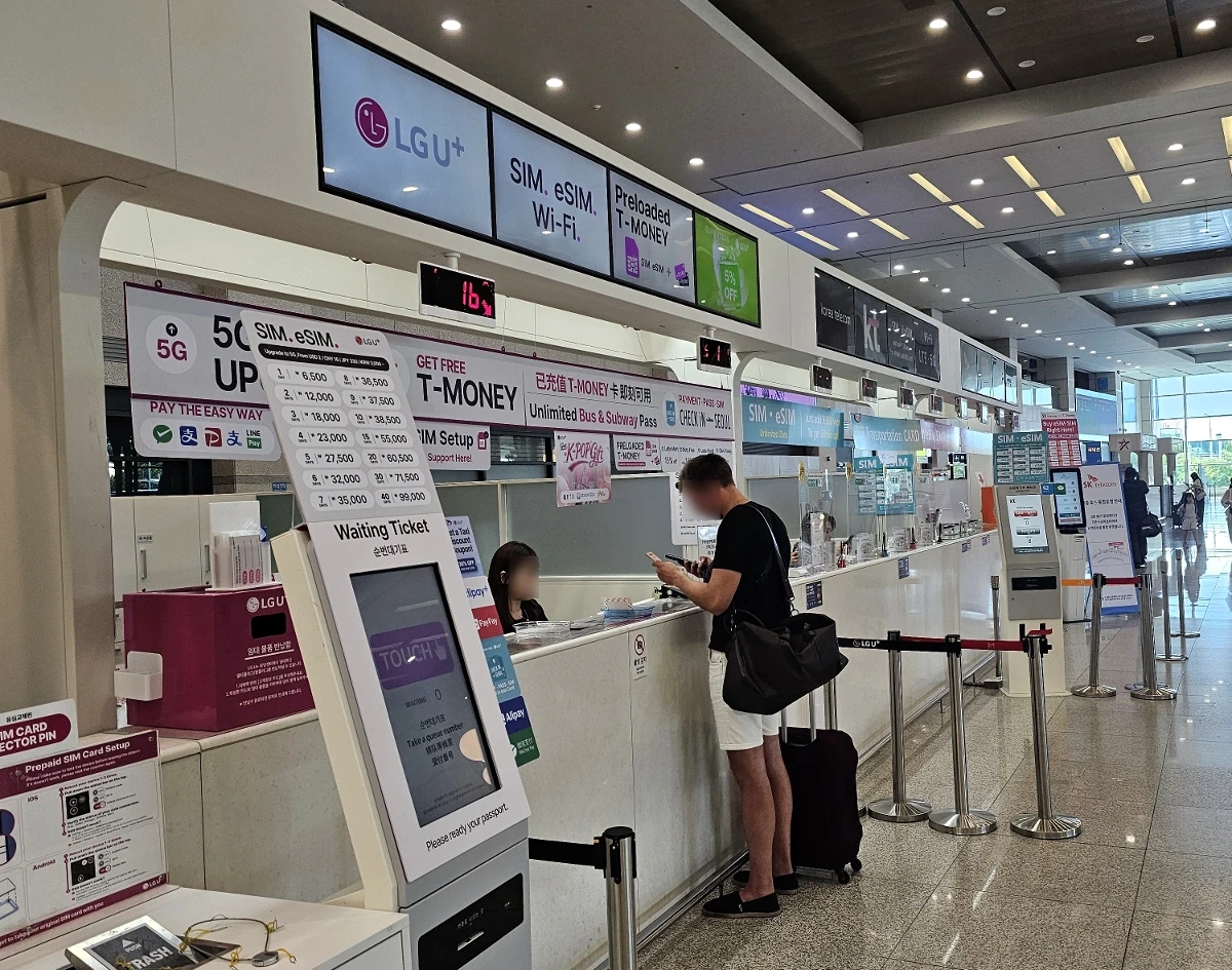 Real LG U+ SIM and eSIM service counter at Incheon Airport with T-money information visible